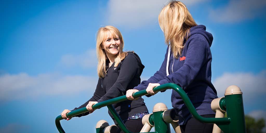 Interviewee using outdoor gym equipment