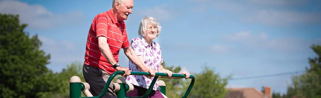 Active older people on outdoor gym specialists
